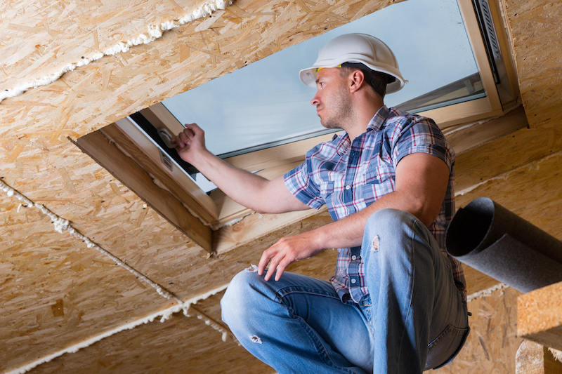 A main installs a skylight to add value to his home.