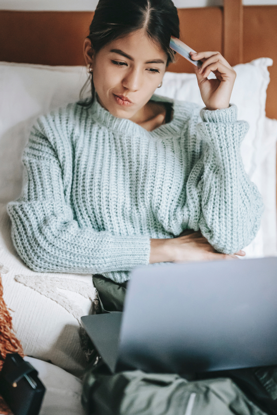 Woman sitting on couch with laptop