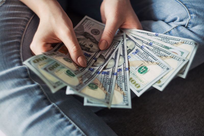 counting money to start paying student loans